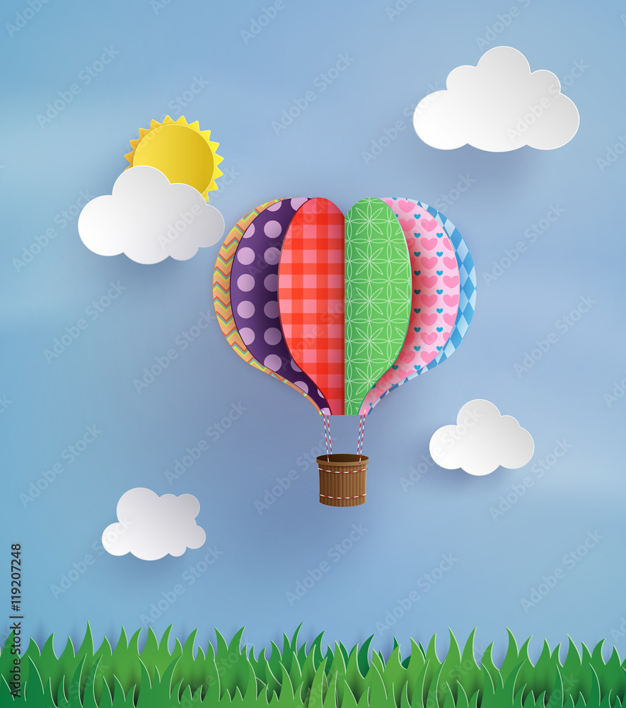 Naklejka premium Colorful Patchwork Hot Air Balloon in the Sky
