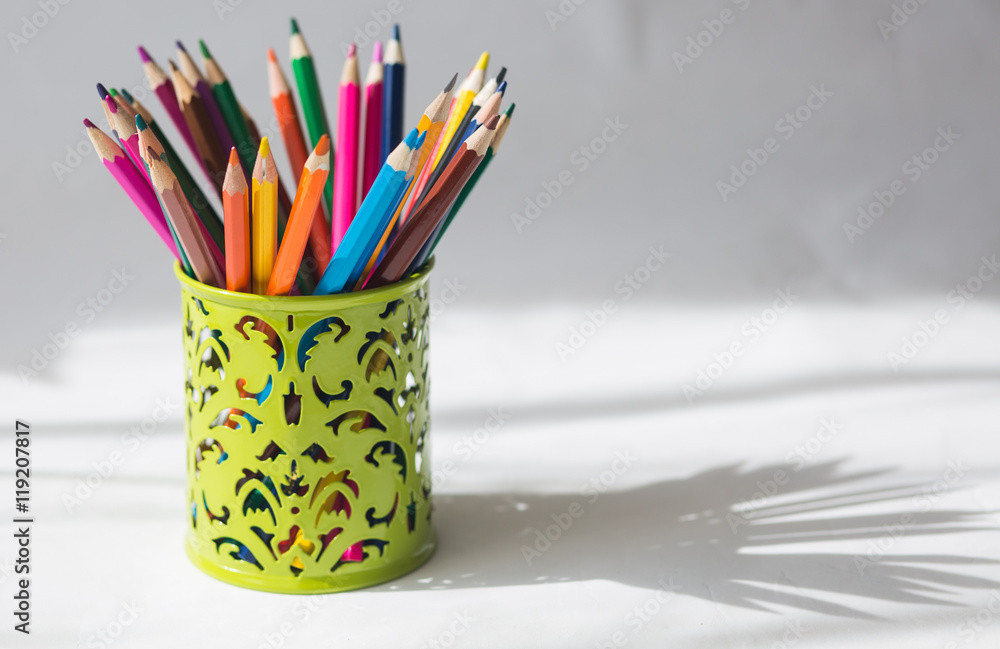colored pencils and felt-tip pens on a white background colored pencils and felt-tip pens on a white background