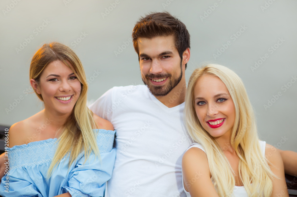 Three friends having fun on the bench Three friends having fun on the bench