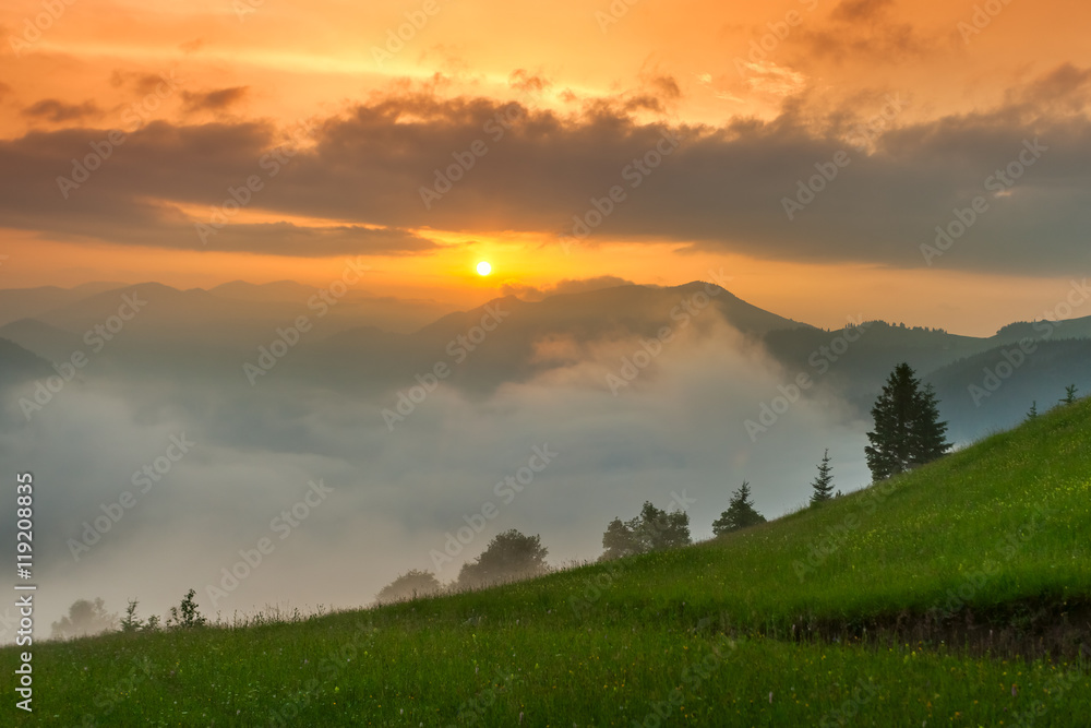 Foggy mountain landscape under morning sky. Carpathian mountains, Ukraine.