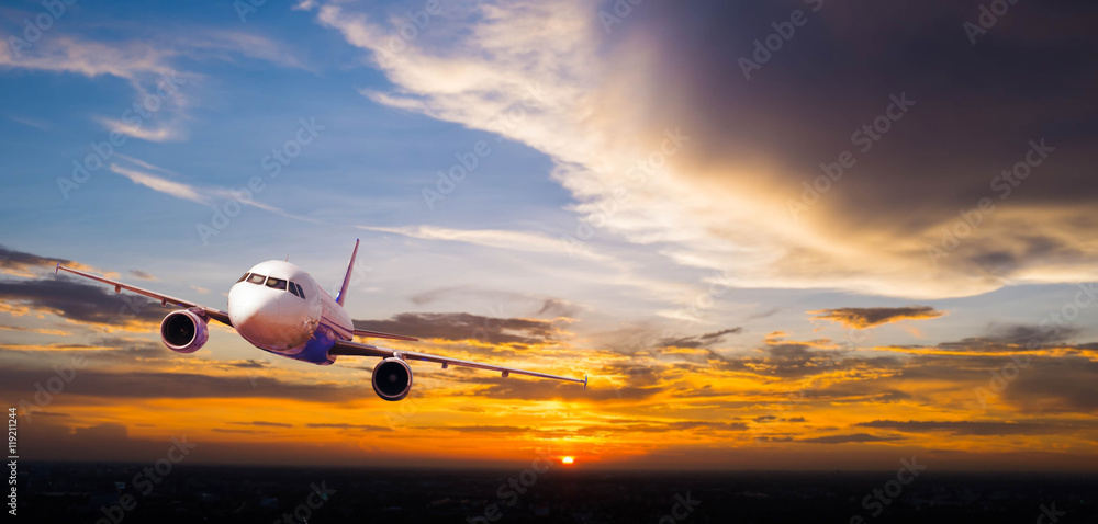 Fototapeta premium Airplane with background of cloudy sky at sunset or sunrise, exp