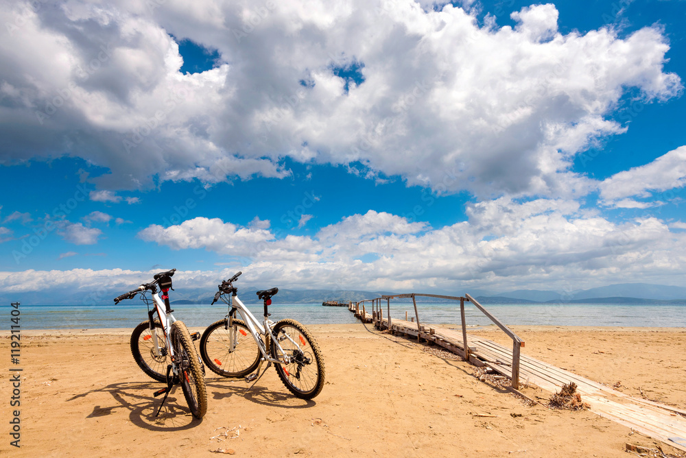 Fototapeta premium Two bicycles on the beach. Corfu island. Greece.