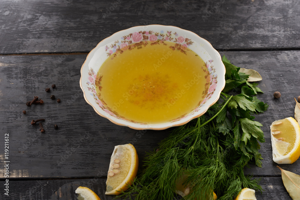 broth and seasonings in a dish on the table broth and seasonings in a dish on the table