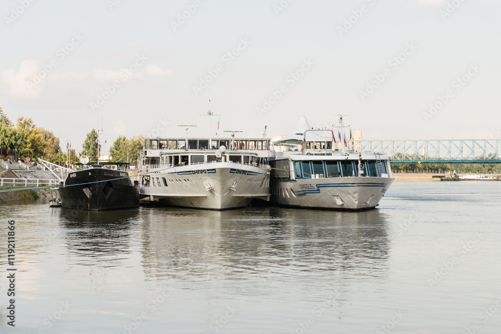 Fototapeta premium Novi Sad, Serbia - Septembe 22, 2013: Passenger ships anchored in Novi Sad