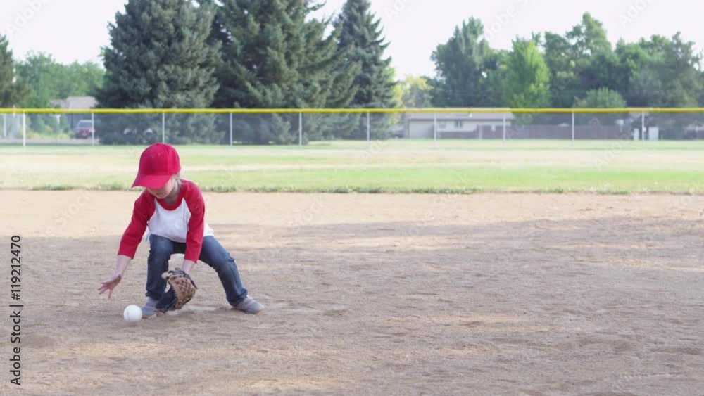Little girl throwing baseball