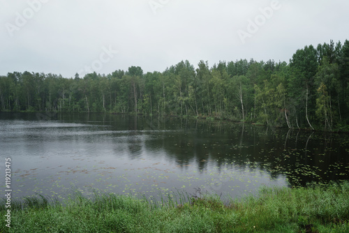 misty morning on scandinavian lake small rain