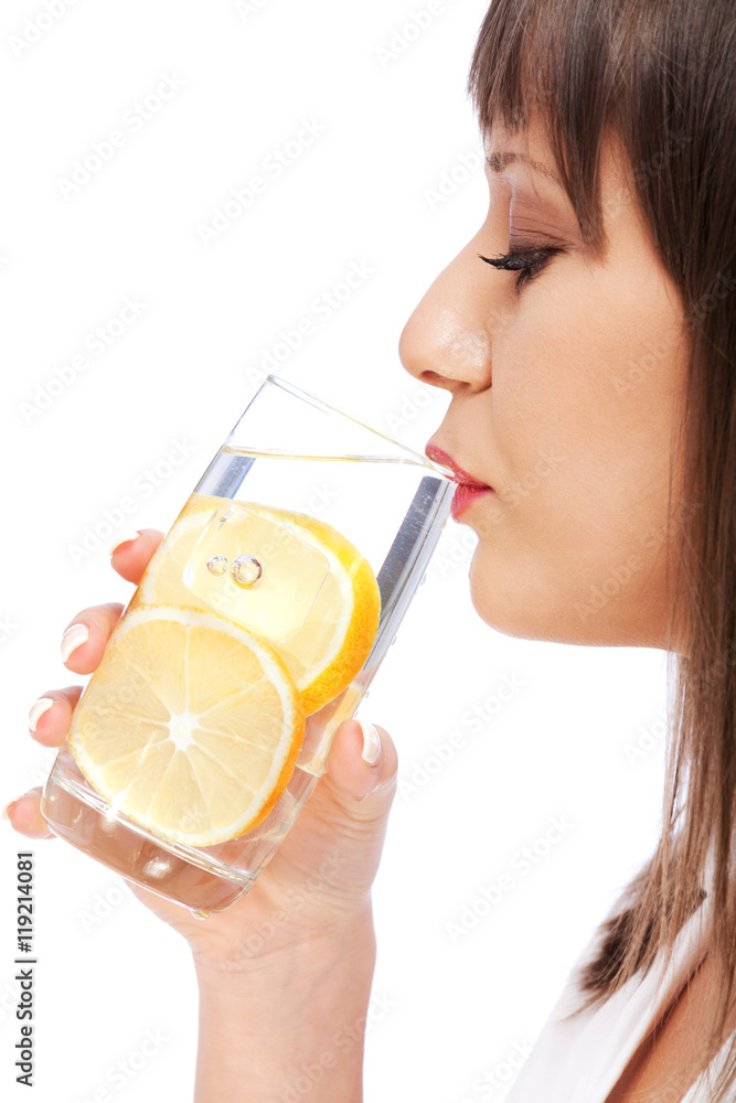 Woman drinking water with lemon Woman drinking water with lemon