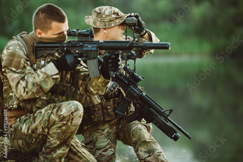 Special forces soldiers with weapon take part in military maneuv