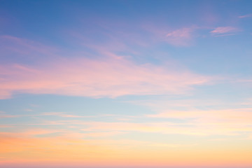 Background of sunrise sky with gentle colors of soft clouds
