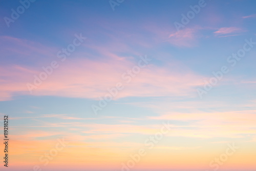 Background of sunrise sky with gentle colors of soft clouds photo