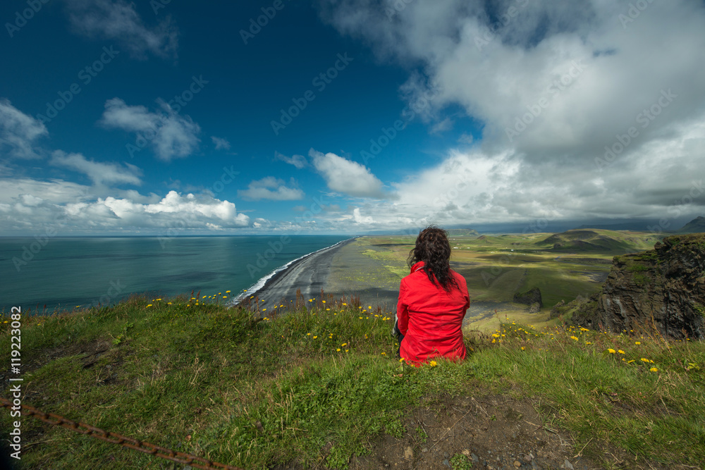 Fototapeta premium Woman is relaxing on the cliff