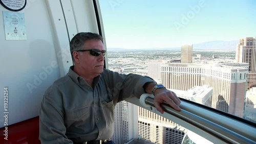 man sitting and looking out the high roller in Las Vegas