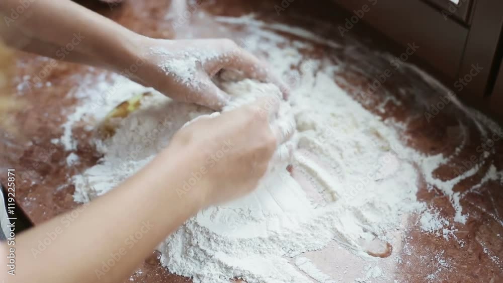 Girl chef kneads the dough for the pie Girl chef kneads the dough for the pie
