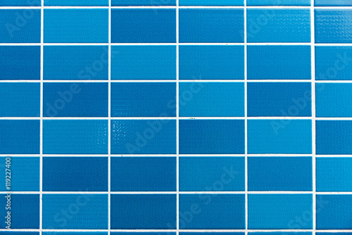 A blue tiled background with relatively small tiles