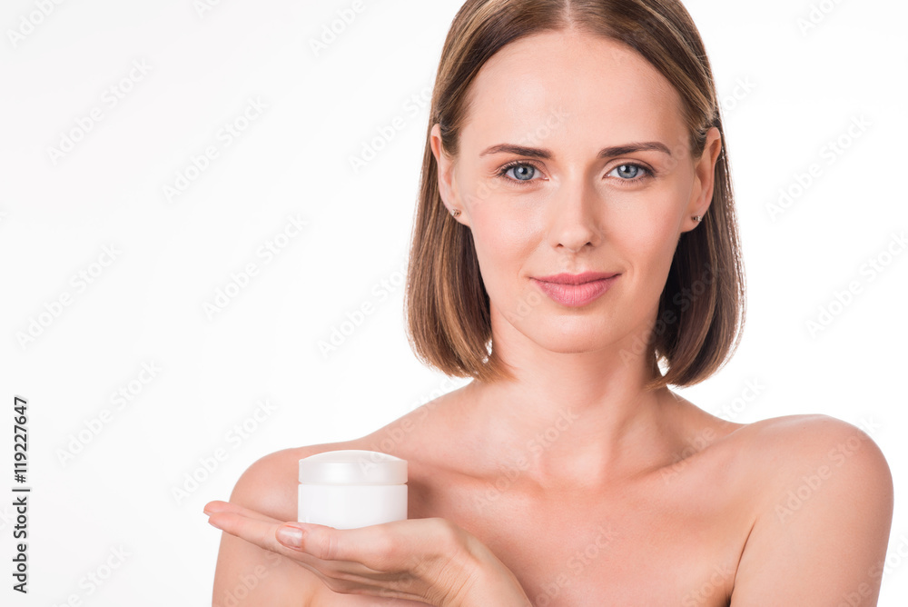 Nice young woman holding cream Nice young woman holding cream