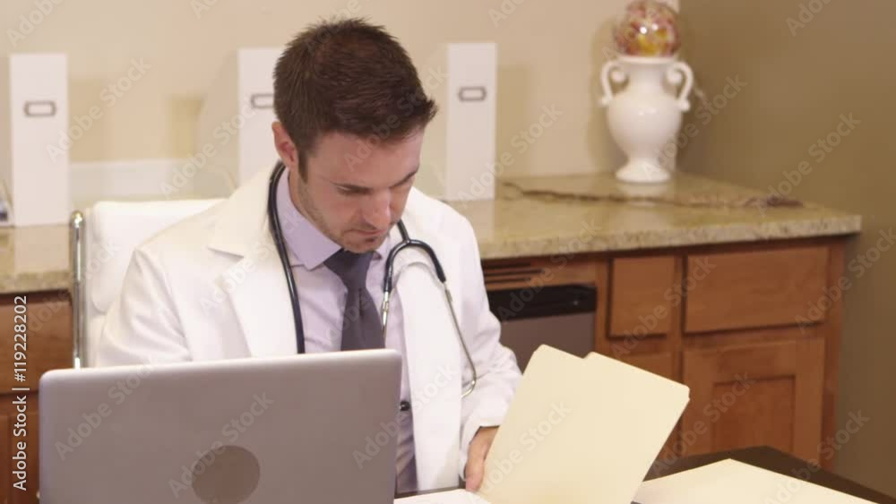 Portrait of doctor looking at files Portrait of doctor looking at files