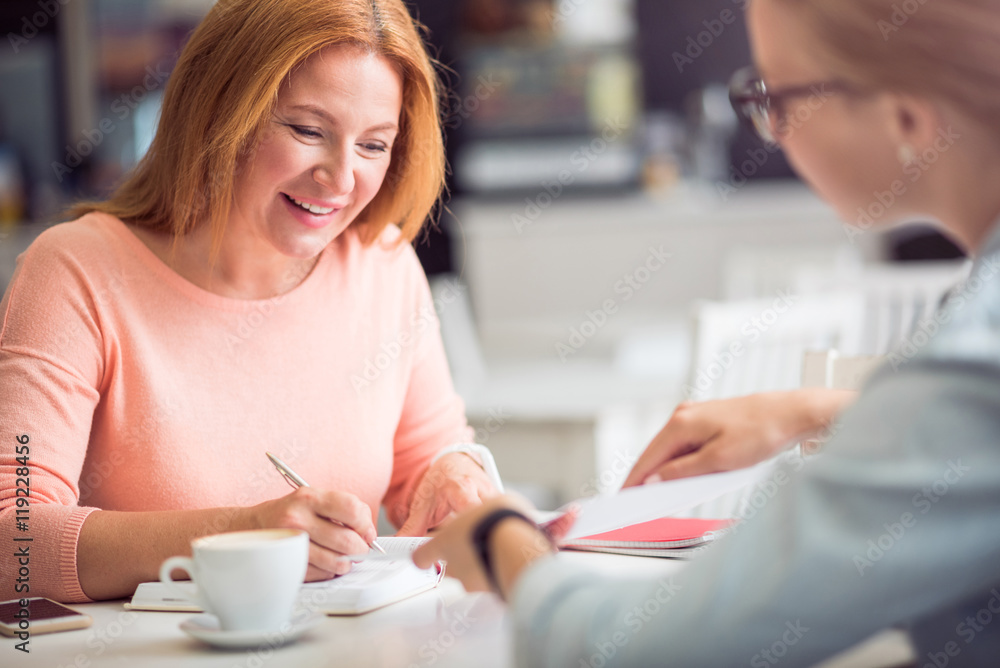 Cheerful woman conducting an interview Cheerful woman conducting an interview
