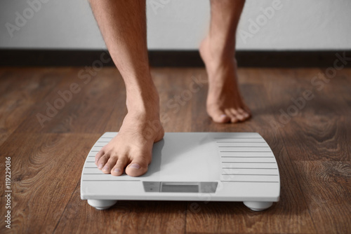 Man standing on weight scale