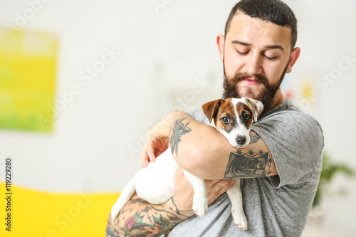 Handsome man with cute dog ...
