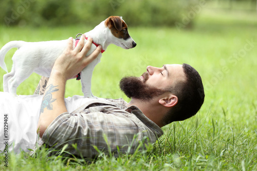 Man with cute dog in spring...