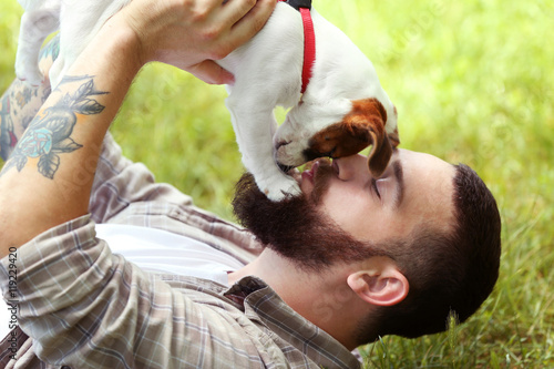 Man with cute dog in spring...