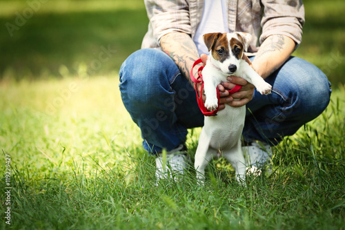 Man with cute dog in spring...