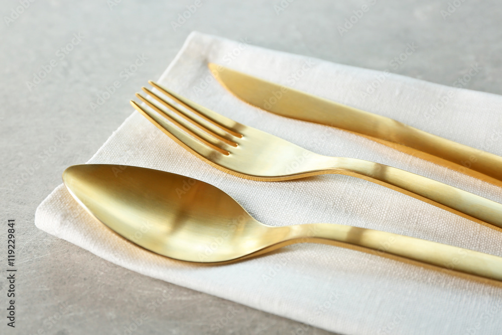 Table setting with cutlery and napkin, closeup Table setting with cutlery and napkin, closeup