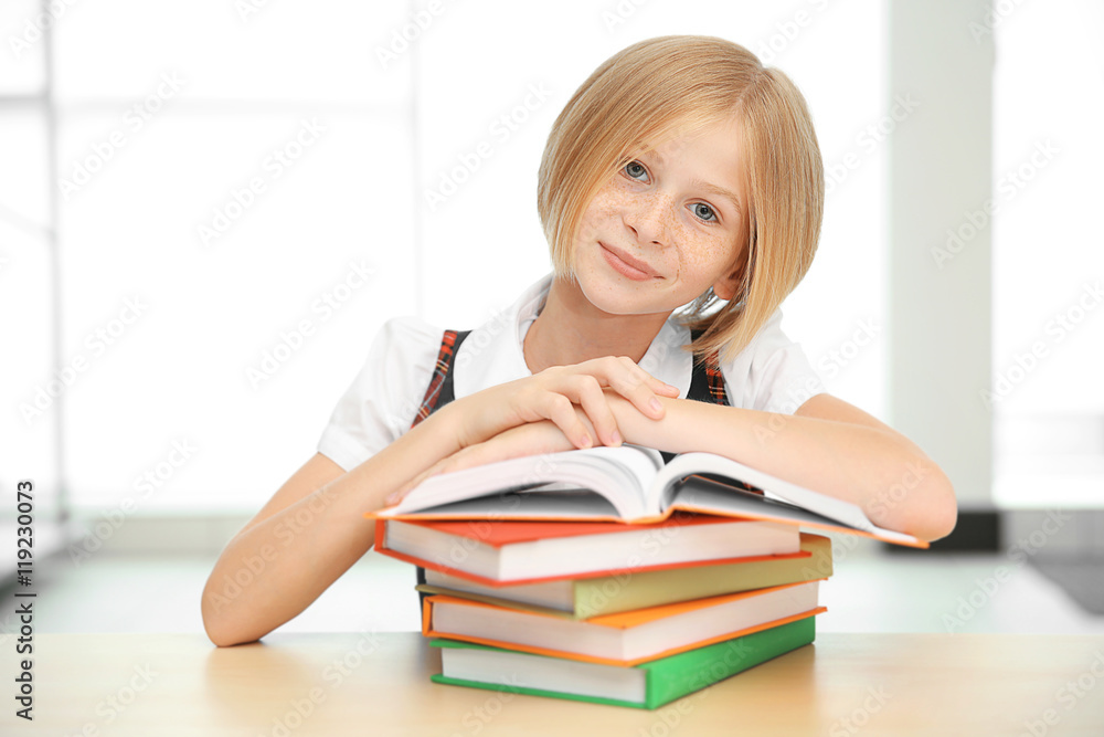 Smiling girl with many books at school Smiling girl with many books at school