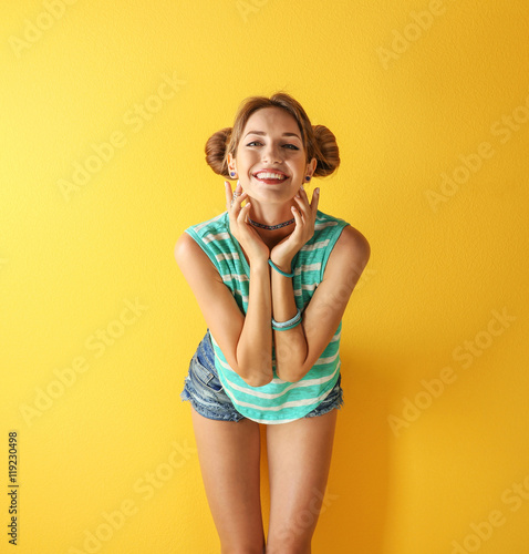 Beautiful girl on yellow ba...