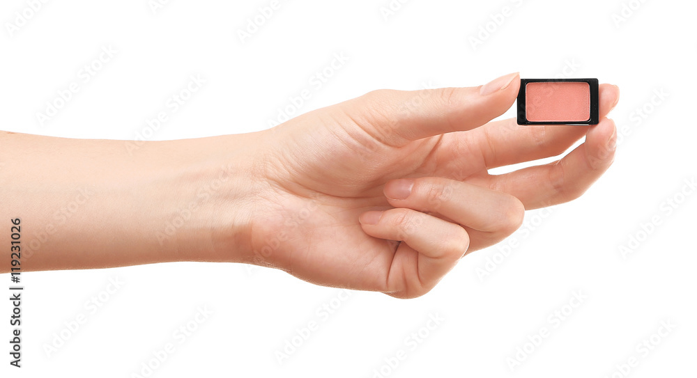 Female hand holding eye shadow, isolated on white Female hand holding eye shadow, isolated on white