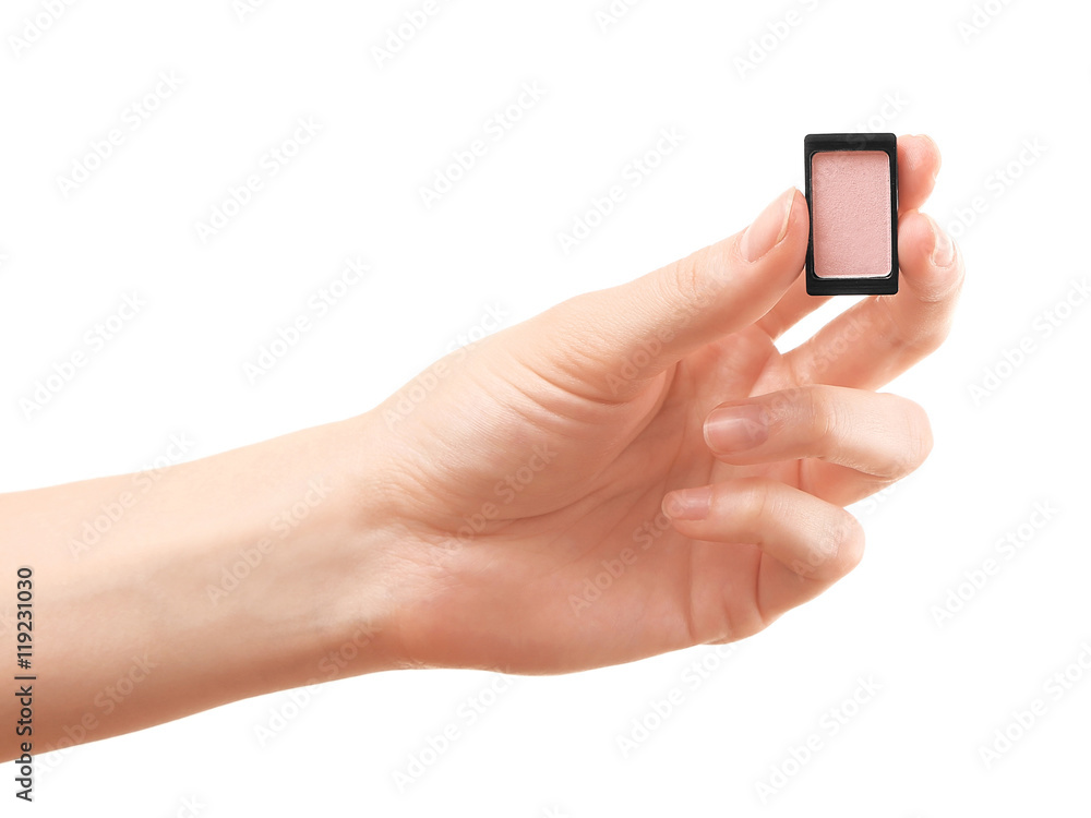 Female hand holding eye shadow, isolated on white Female hand holding eye shadow, isolated on white