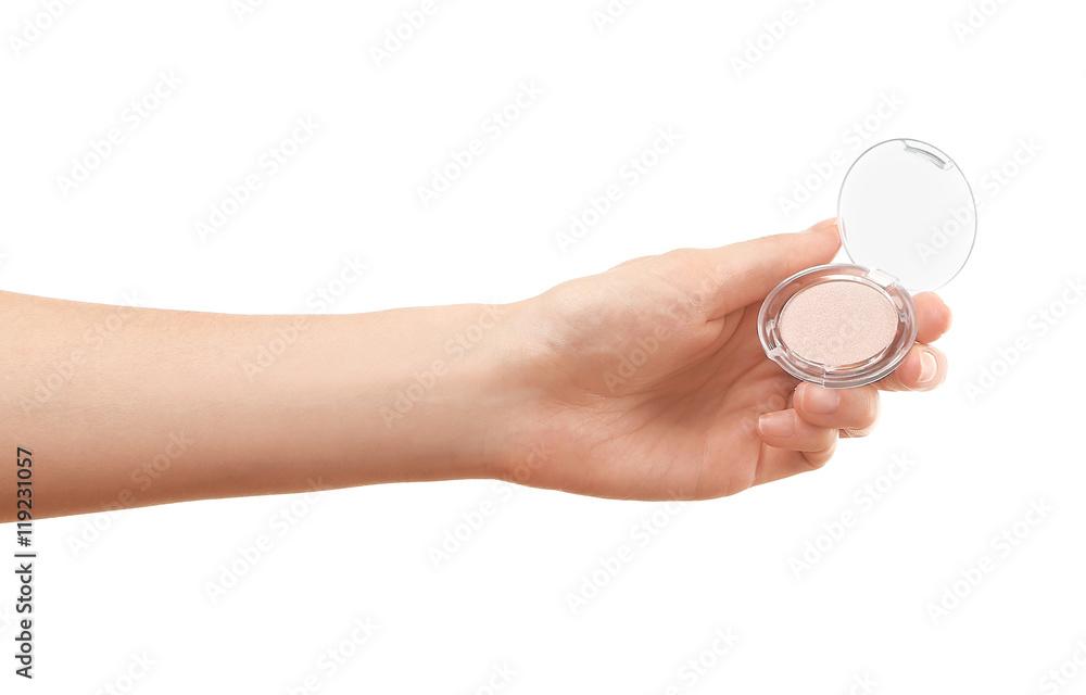 Female hand holding eye shadow, isolated on white Female hand holding eye shadow, isolated on white