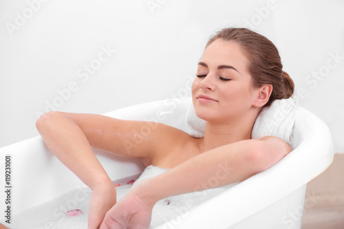 Beautiful girl relaxing in bathtub