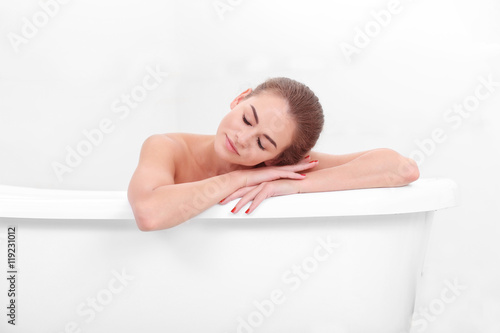 Beautiful girl relaxing in bathtub