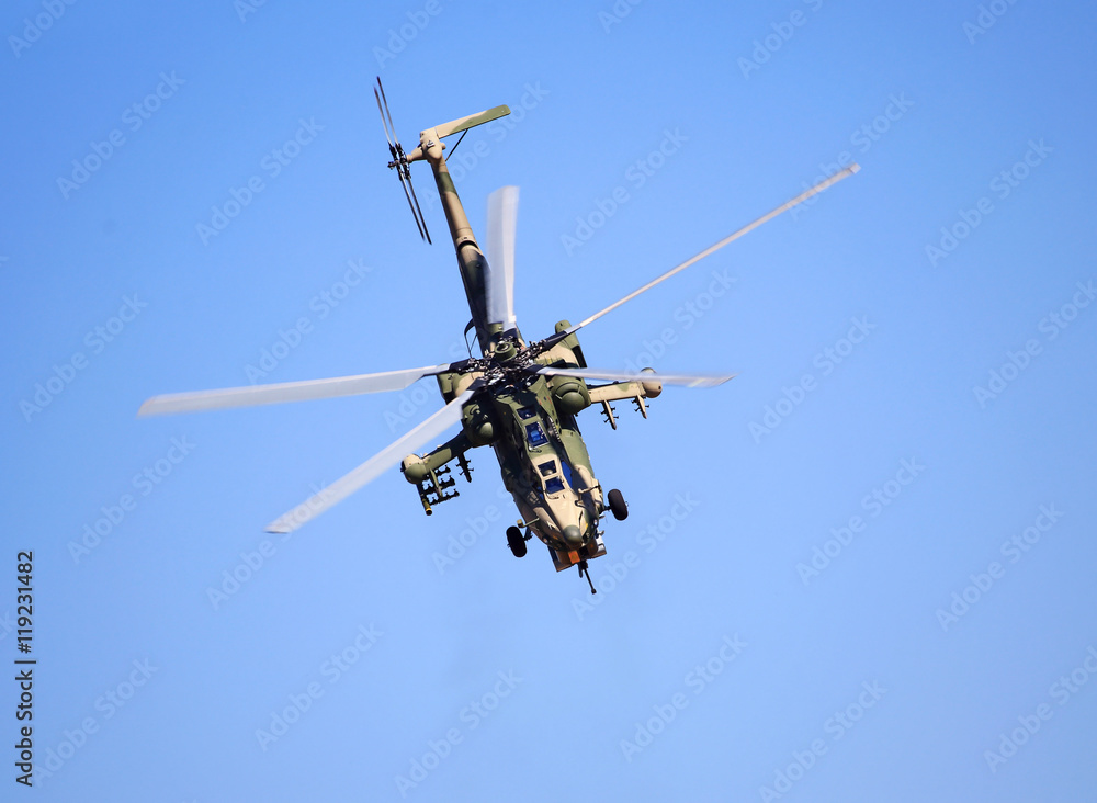 Combat helicopter in flight Combat helicopter in flight