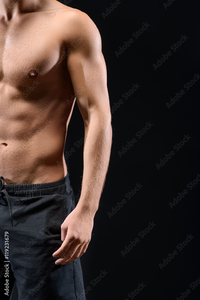 Muscular man showing his bare torso