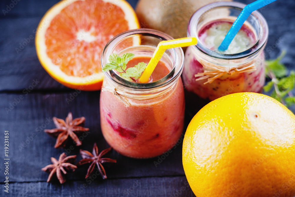 Jars with smoothies and fruits Jars with smoothies and fruits