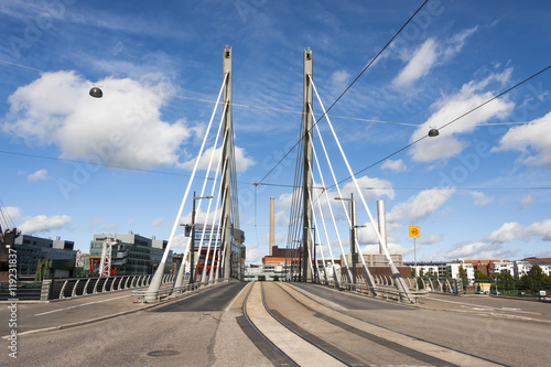 Big white suspension bridge with tram rails