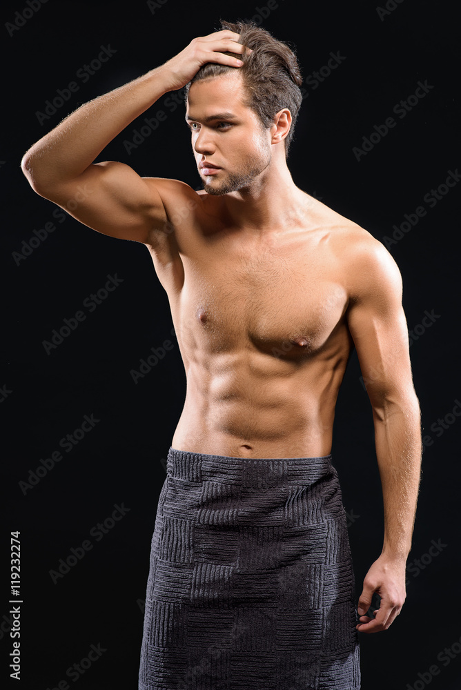 Fototapeta premium Attractive guy resting after shower