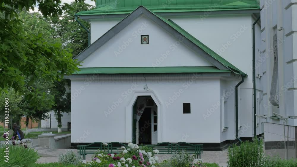 Green Roofed Small Church Entrance Sunny Day Courtyard of Church in Poltava Alleys Flower Beds Trees and Lawns White Walls and Small Windows Summer Green Roofed Small Church Entrance Sunny Day Courtyard of Church in Poltava Alleys Flower Beds Trees and Lawns White Walls and Small Windows Summer