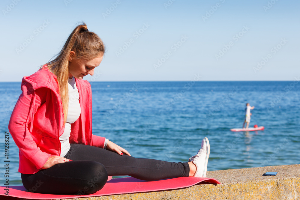Woman resting relaxing after doing sports outdoors