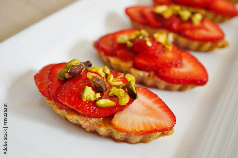 Vegan pistachio financier cakes with strawberries