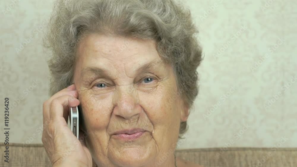 Senior woman holding smartphone talk to doctor Senior woman holding smartphone talk to doctor