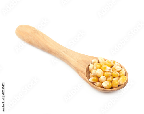 Wooden spoon filled with corn