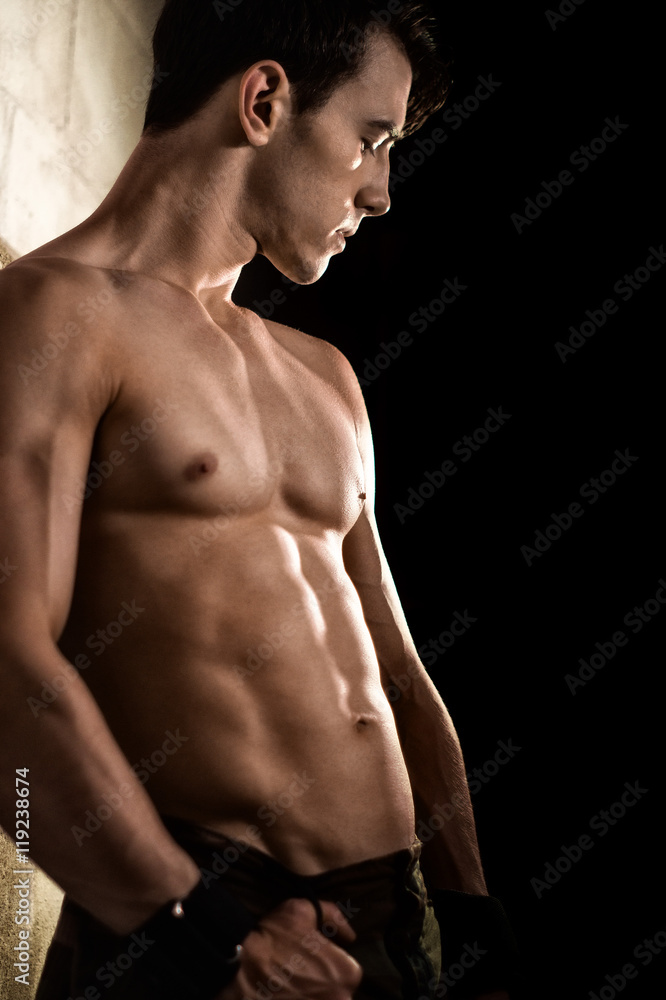 Fototapeta premium Athletic Man Flexing