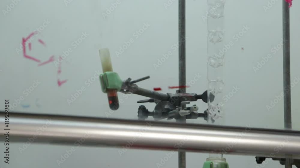 Scientist dripping chemicals for testing controlled explosion Scientist dripping chemicals for testing controlled explosion