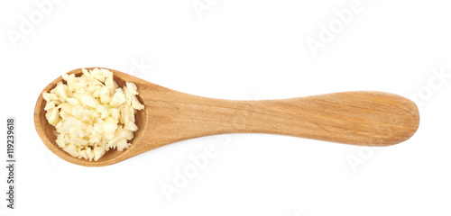 Spoon of minced garlic isolated