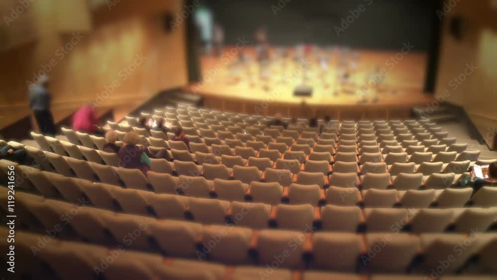 audience filling up theatre hall audience filling up theatre hall