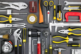 set of different hand tools on grey background