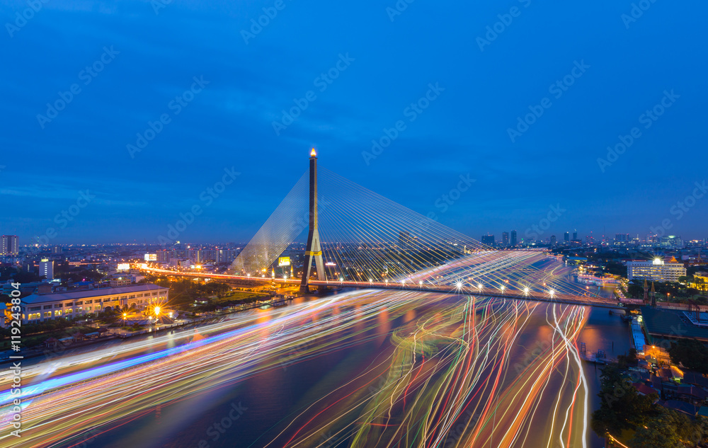 Naklejka premium Rama 8 Bridge crosses Chao Phraya the river with speed light in Bangkok